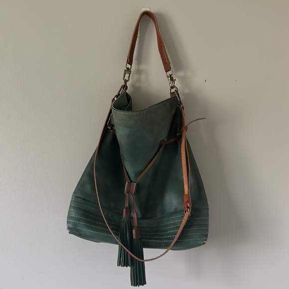 Free People Handbags - Free people Green cross body bag with tassels.